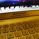 Illustration for article titled Gold MacBook Air Has Bejeweled Rainbow Apple
